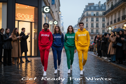 Imagine 3 beautiful woman in their 20s one is a beautiful sexy black lady and handsome man all 4 person wearing a trending fashion mode set hoodie and pant each person wearing a different color in the hoodie is written GOGLE.they walking on a wet street at Paris in front the GOGLE company a lot of people watch their look because it s trending and on the street is written Get Ready For Winter.